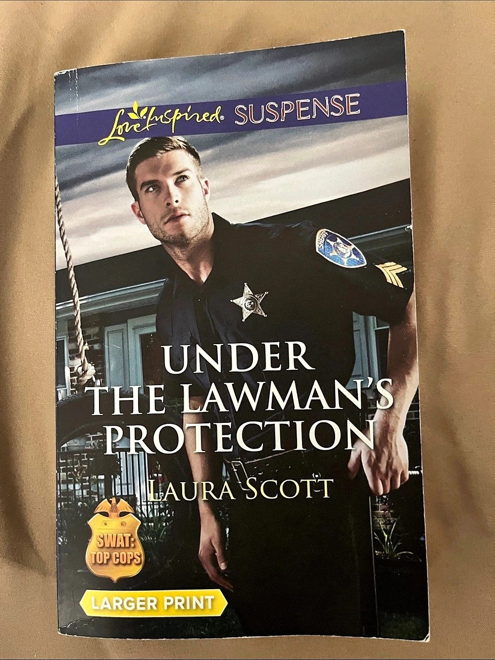 Love Inspired Under the Lawman's Protection Larger Print Romance Suspense Book